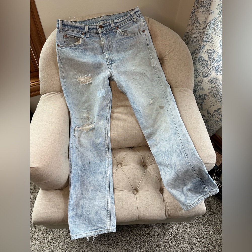 Vintage 80s or 90s  thrashed/trashed Levi’s orange tab, light wash jeans.  32x29
